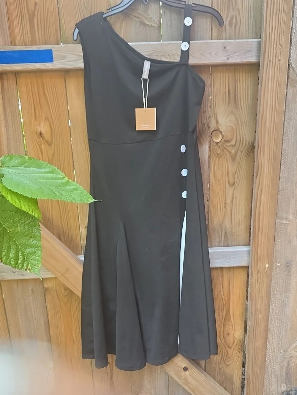 Elegant One-Shoulder Black Dress with Side Button Detail